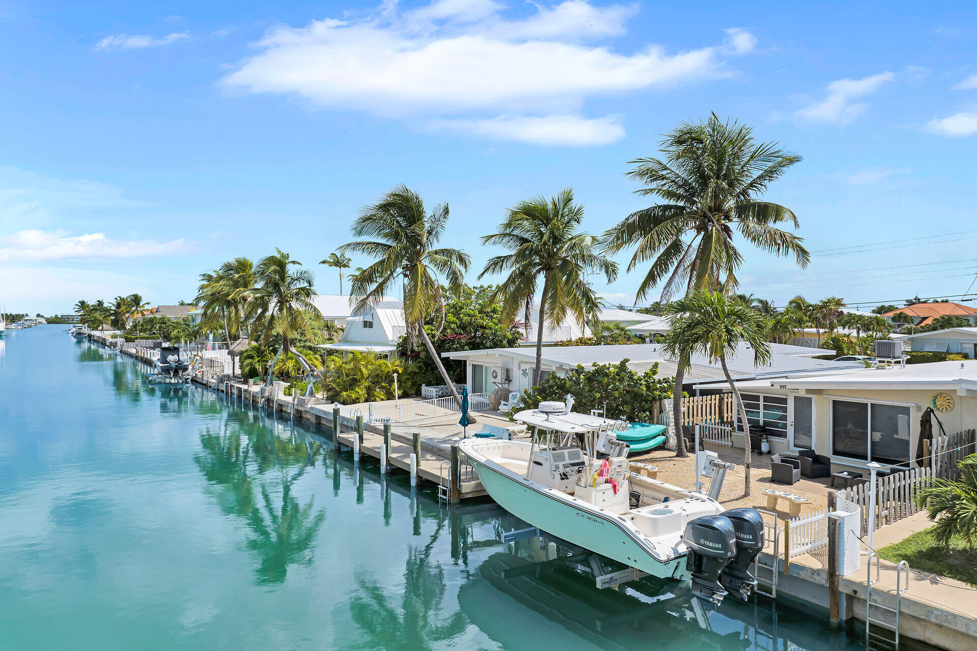 211 5th Street Key Colony Beach, FL 33051 - Photo 20 of 28 a view of a lake with couches and city view