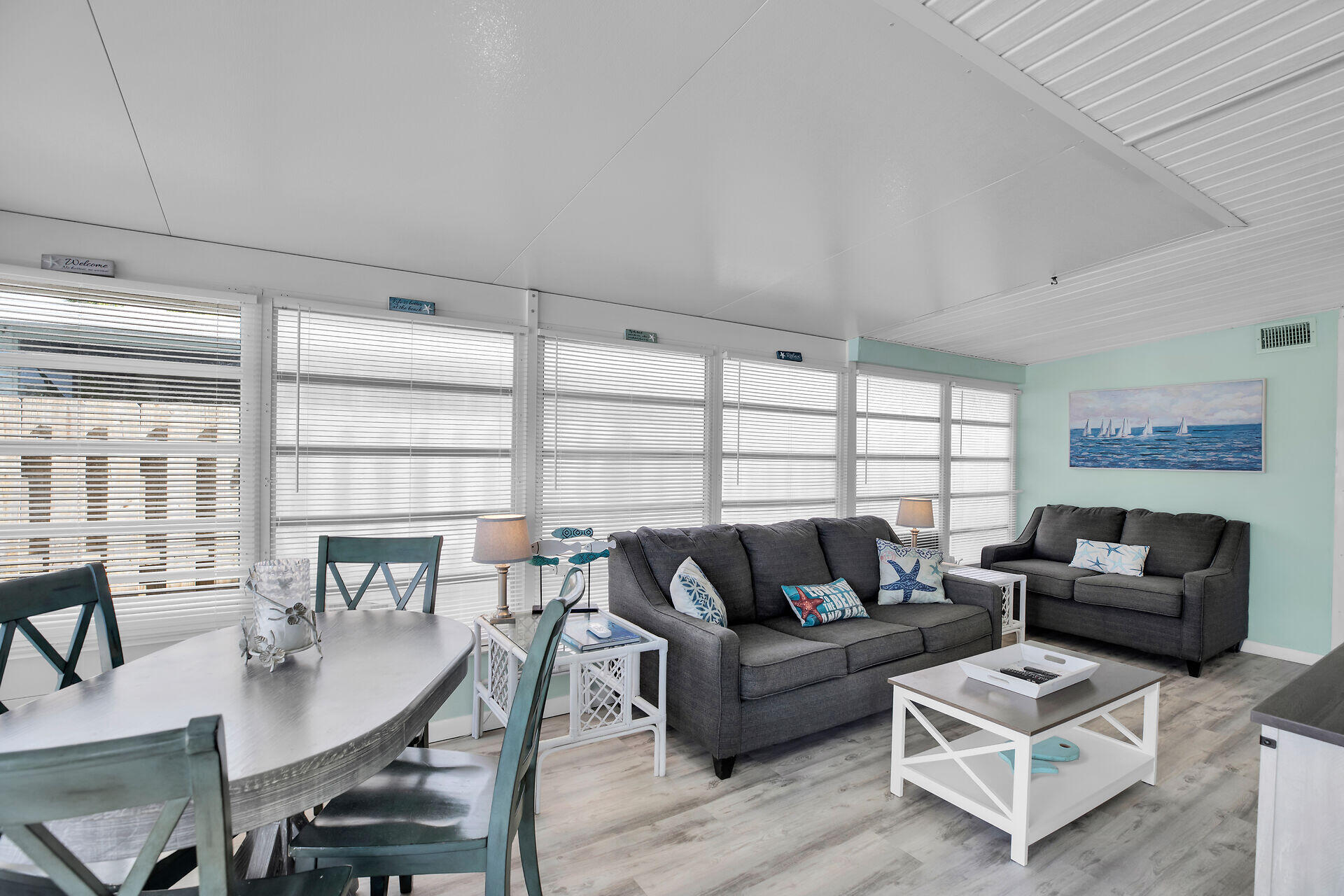 211 5th Street Key Colony Beach, FL 33051 - Photo 2 of 28 a living room with furniture and a large window