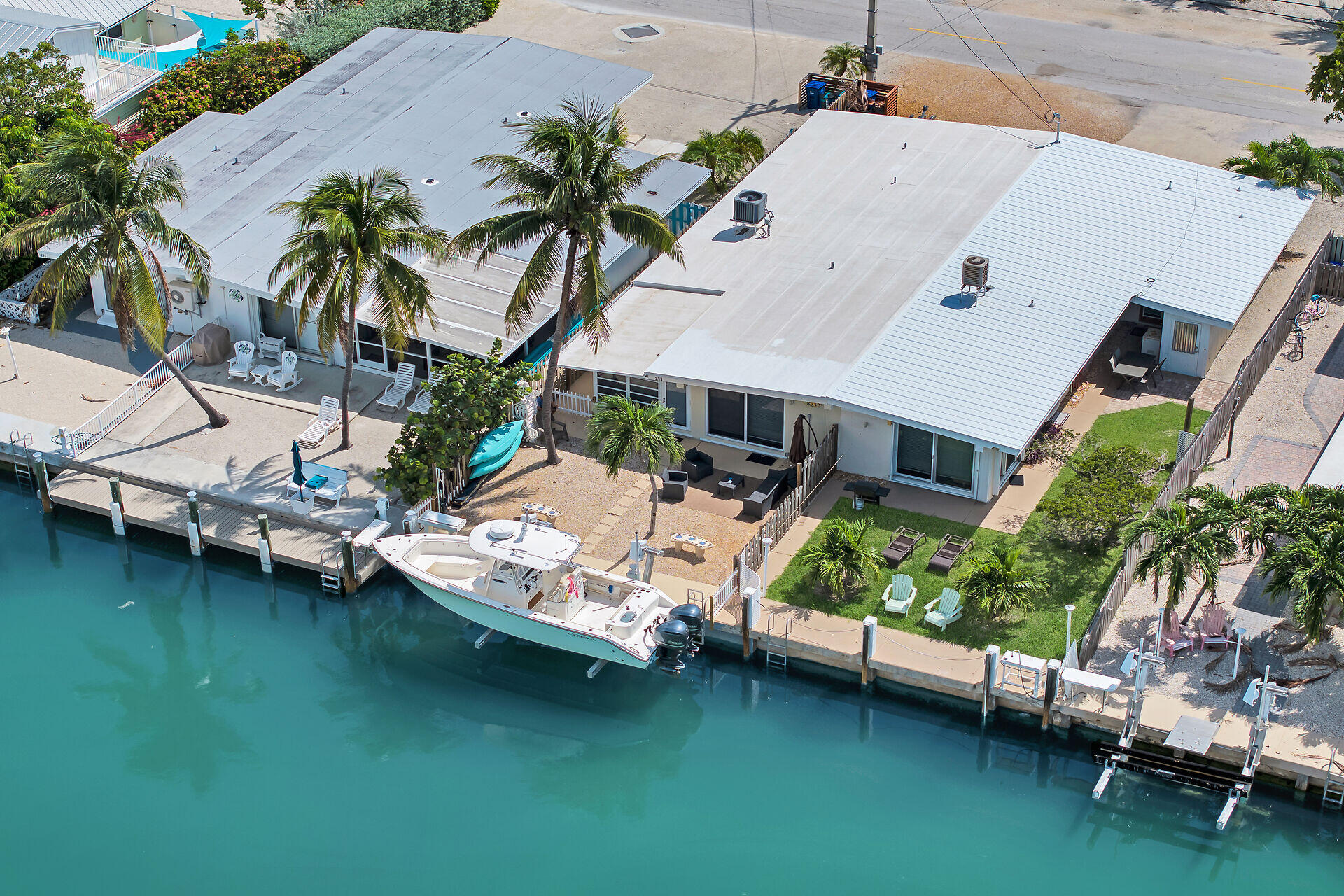 211 5th Street Key Colony Beach, FL 33051 - Photo 21 of 28 a view of a house with a yard and sitting area
