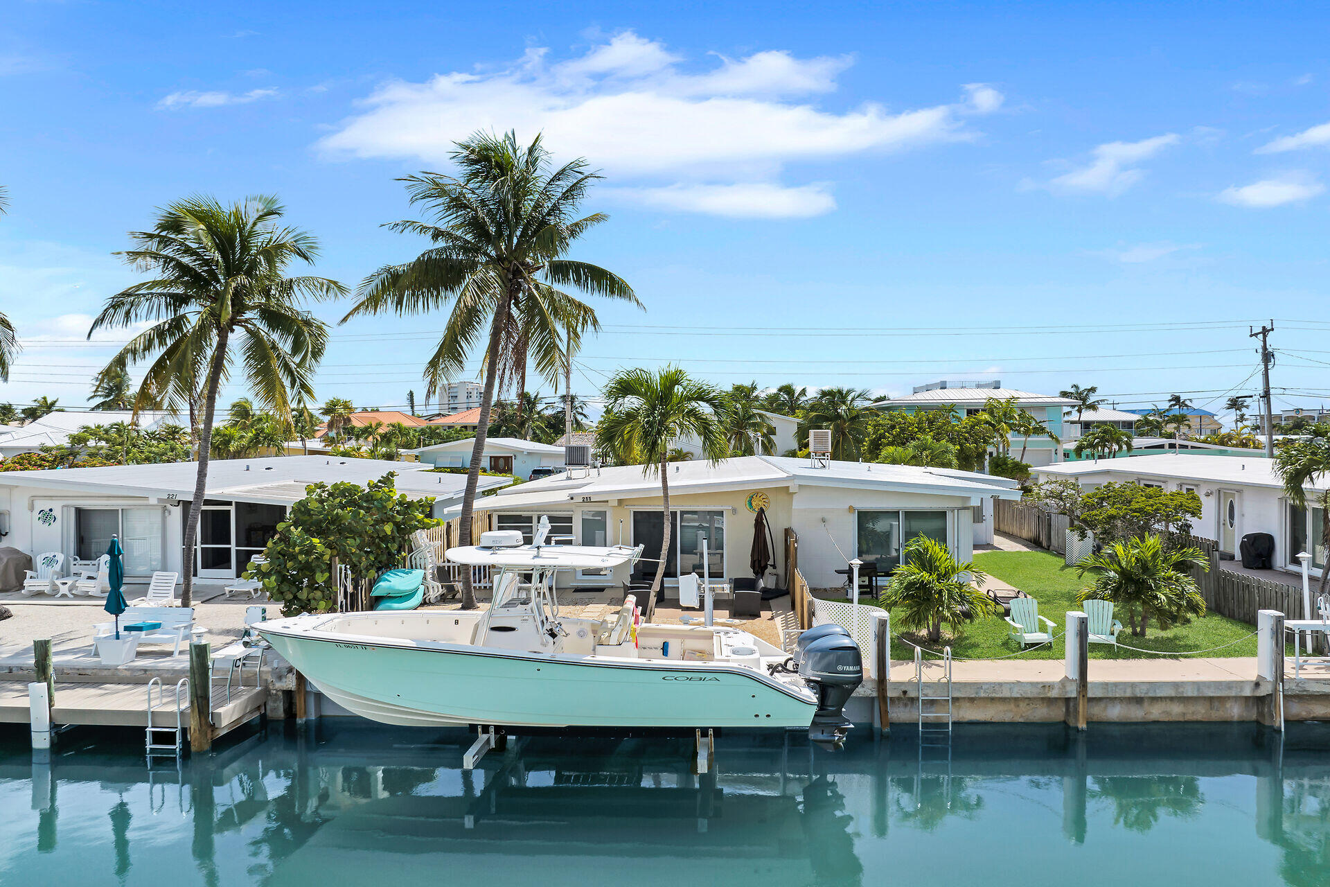 211 5th Street Key Colony Beach, FL 33051 - Photo 22 of 28 a view of house with outdoor seating and lake view