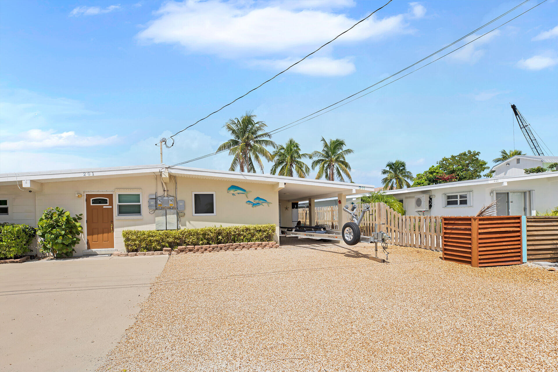 211 5th Street Key Colony Beach, FL 33051 - Photo 23 of 28 a front view of a house with a yard