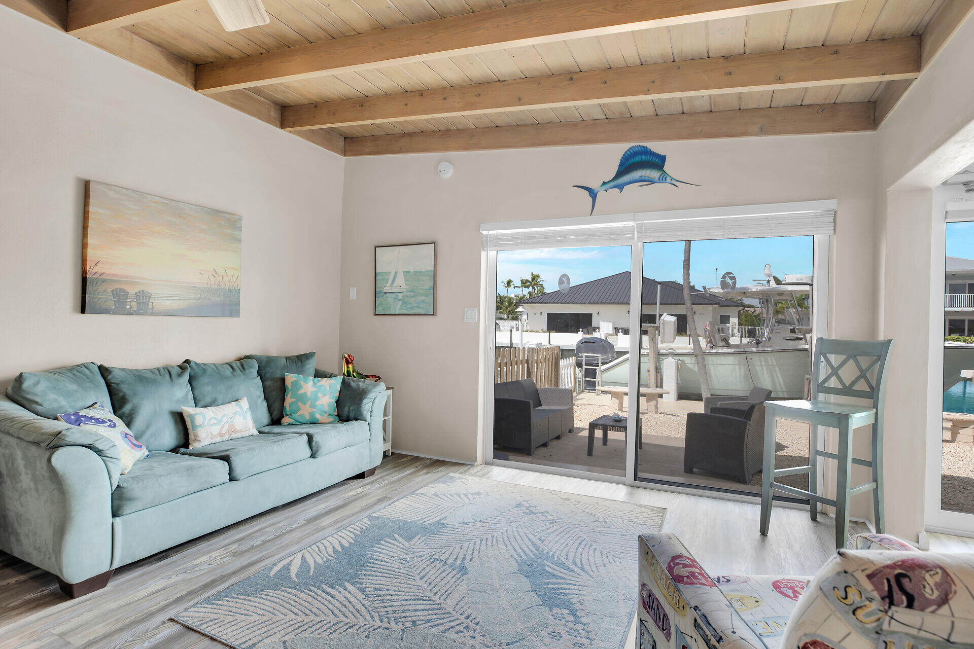 211 5th Street Key Colony Beach, FL 33051 - Photo 4 of 28 a living room with furniture and a table