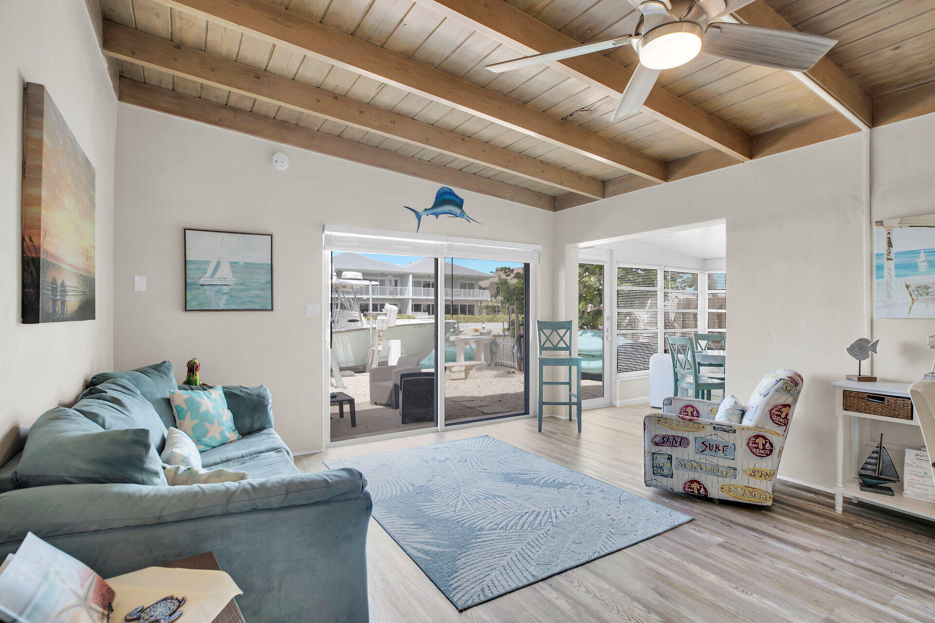 211 5th Street Key Colony Beach, FL 33051 - Photo 7 of 28 a living room with furniture and a large window