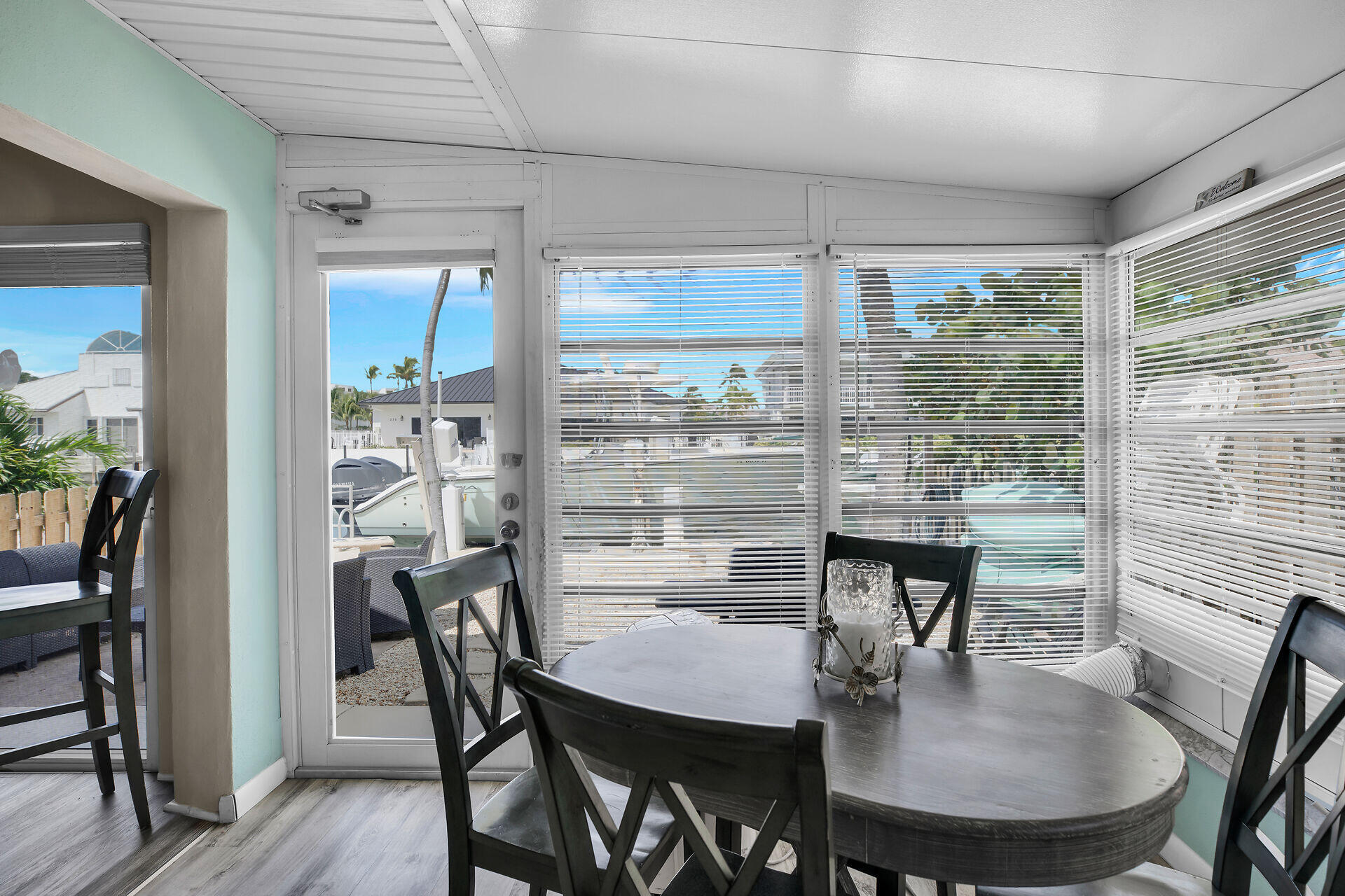 211 5th Street Key Colony Beach, FL 33051 - Photo 8 of 28 a dining room with furniture window and wooden floor
