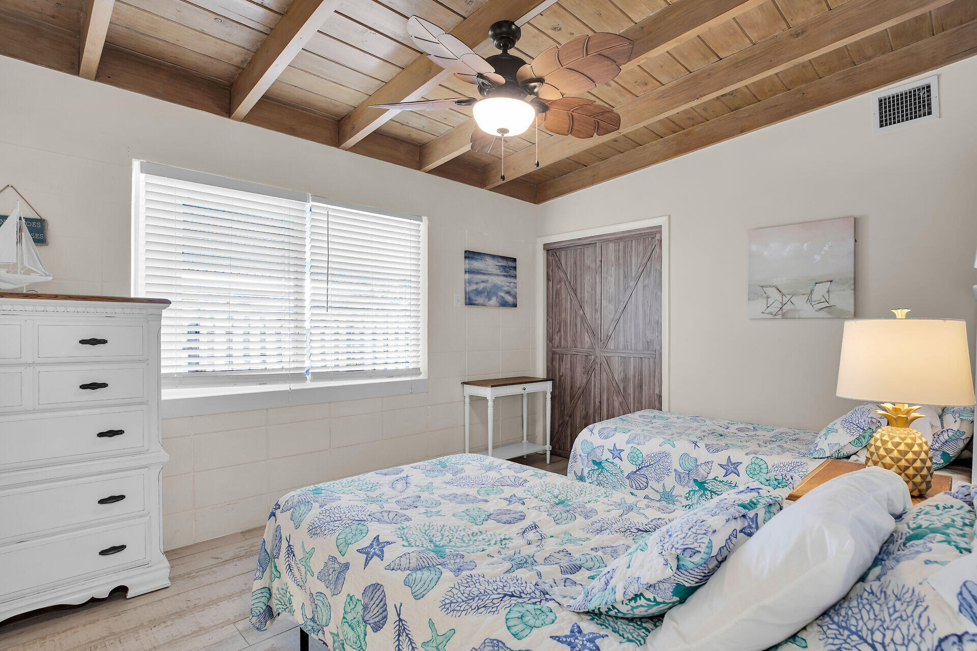 211 5th Street Key Colony Beach, FL 33051 - Photo 10 of 28 a bedroom with a large bed and a window