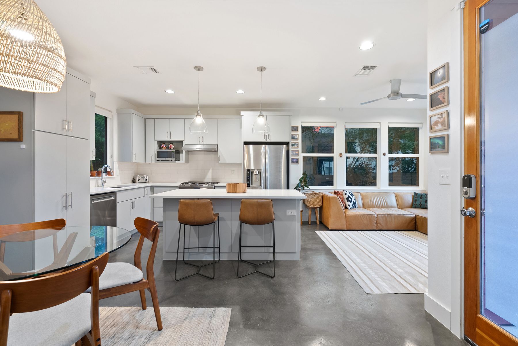 1709 Perez Street, Unit 2 Austin, TX 78721 - Photo 9 of 33 A contemporary open-concept layout unites the kitchen and living areas, offering effortless entertaining.