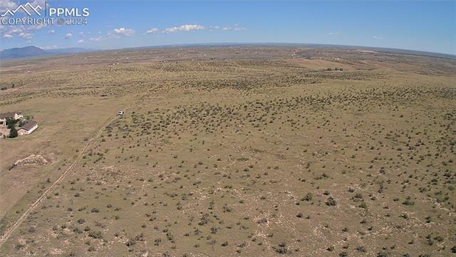 5581 Antelope Road Fountain, CO 80817 - Photo 2 of 13 Aerial view with a mountain view