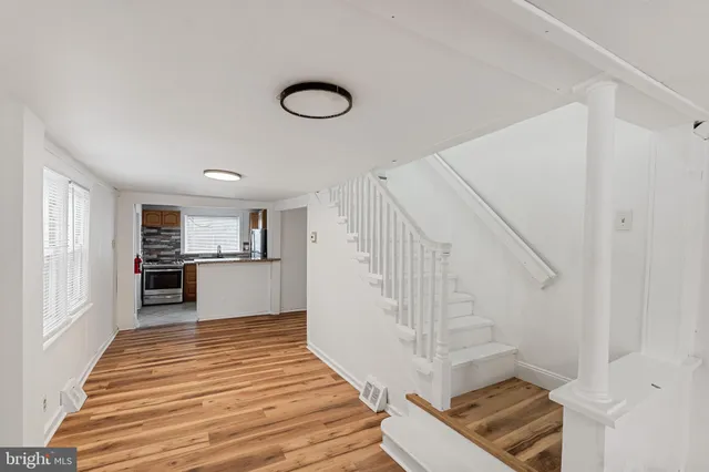 a view of a kitchen from the hallway