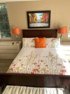 a view of a living room with a bed