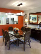 a kitchen with a table and chairs