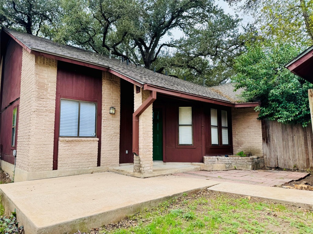 907 Milford Way, Unit A Austin, TX 78745 - Photo 2 of 16 a front view of a house with a yard