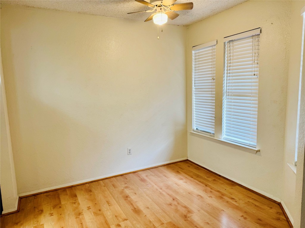 907 Milford Way, Unit A Austin, TX 78745 - Photo 10 of 16 an empty room with a window