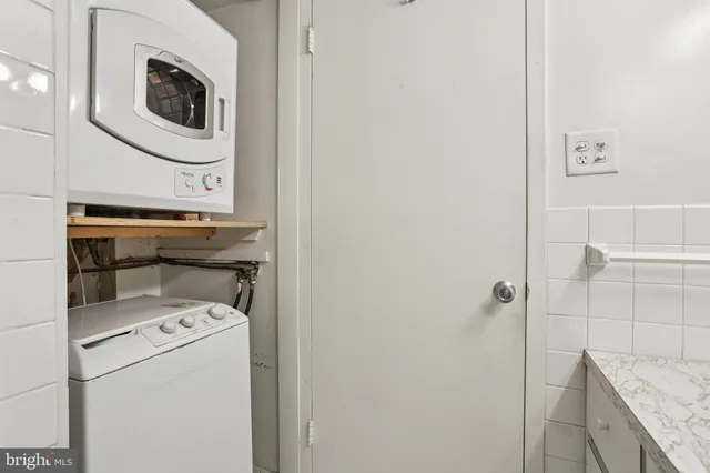 a utility room with dryer and washer