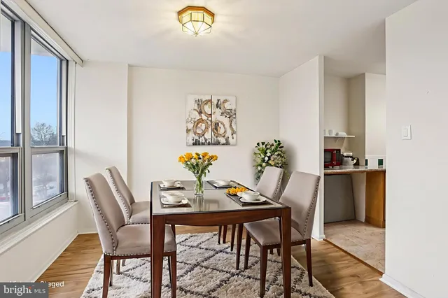 a view of a dining room with furniture and window