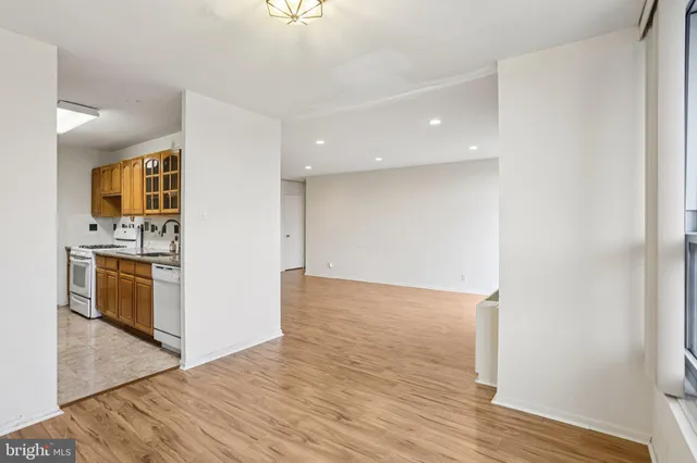 a view of a kitchen with wooden floor