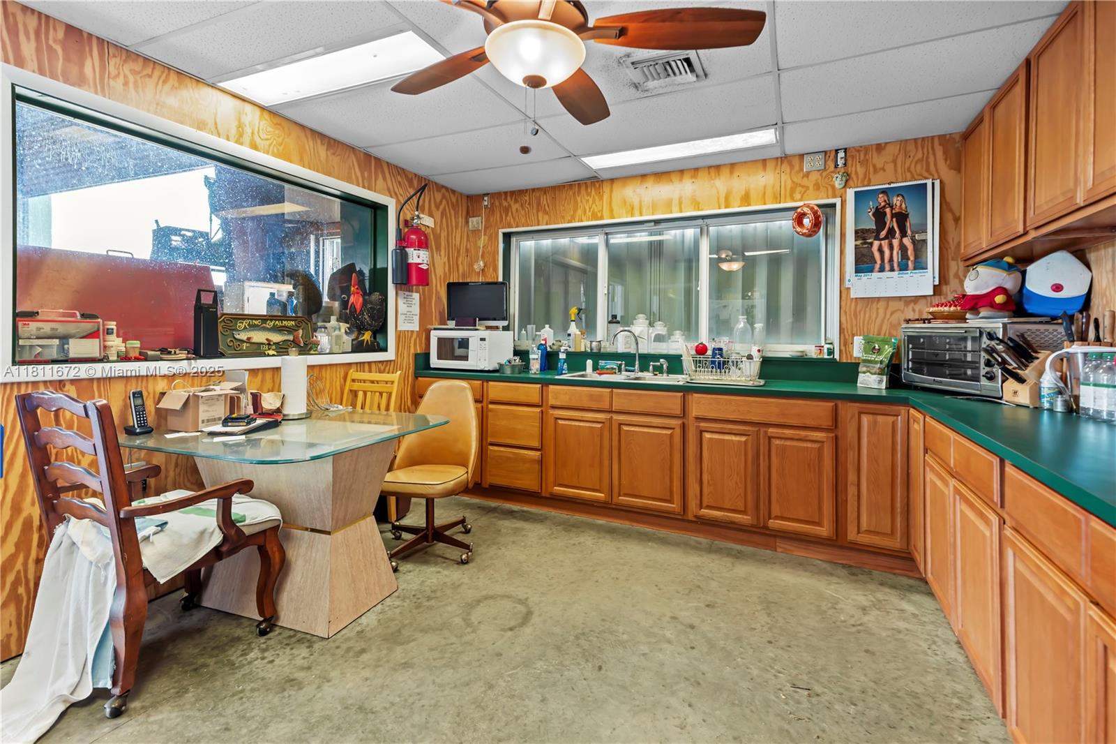 4077 Southwest 121st Terrace Davie, FL 33330 - Photo 14 of 85 a large kitchen with a table and chairs