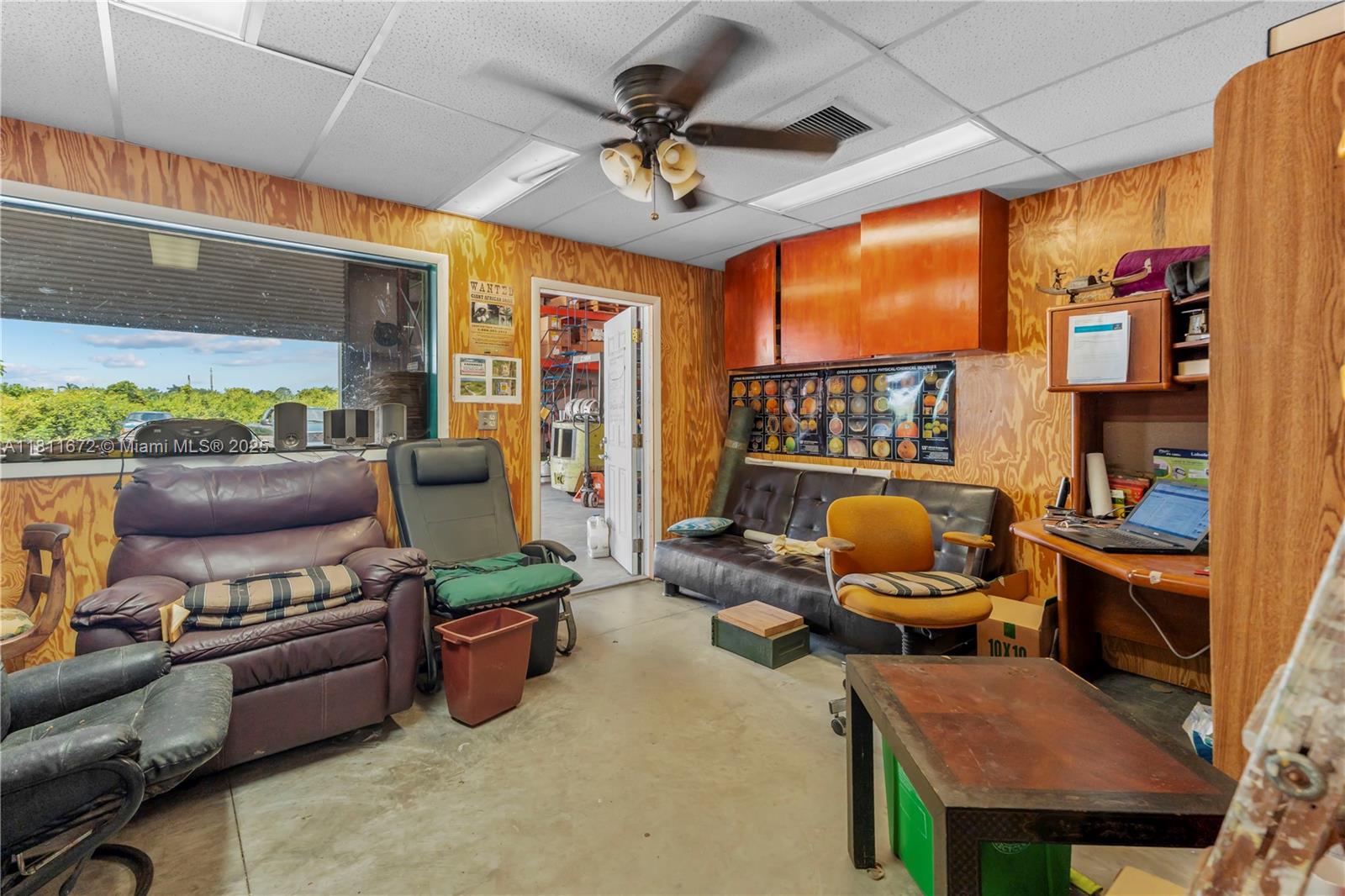 4077 Southwest 121st Terrace Davie, FL 33330 - Photo 23 of 85 a living room with furniture a floor to ceiling window and a flat screen tv