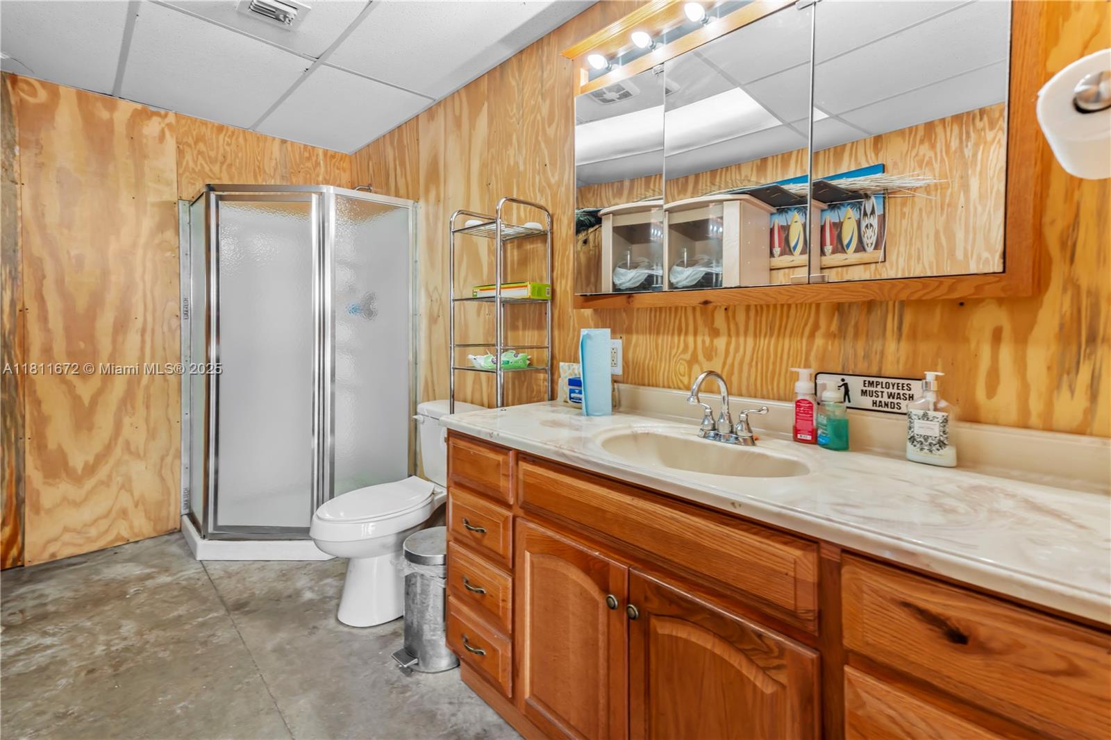 4077 Southwest 121st Terrace Davie, FL 33330 - Photo 29 of 85 a bathroom with a granite countertop sink mirror vanity and toilet