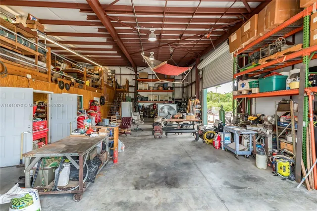 an aerial view of residential houses with outdoor space and swimming pool