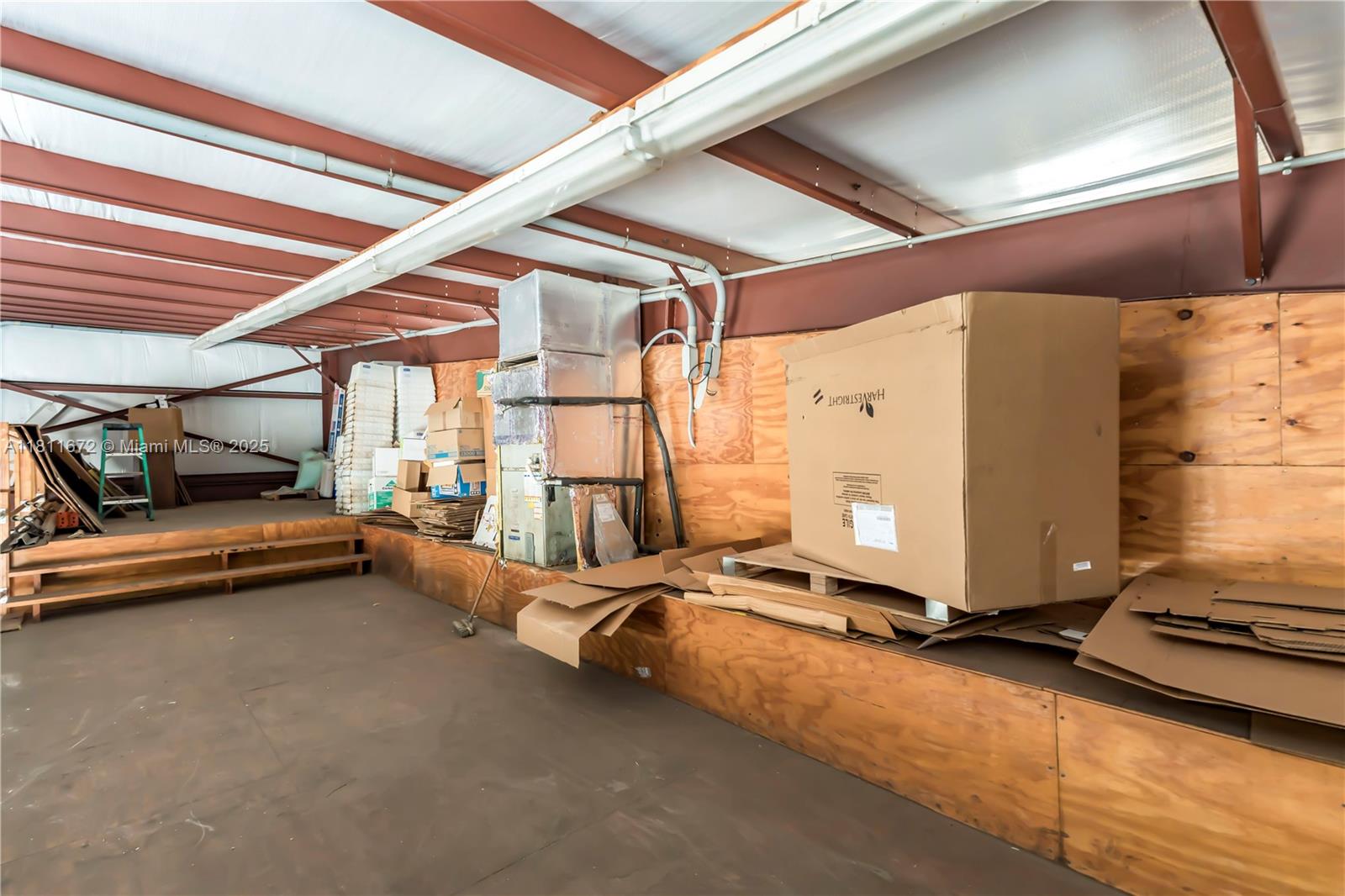 4077 Southwest 121st Terrace Davie, FL 33330 - Photo 38 of 85 a room with gym equipment and a large window