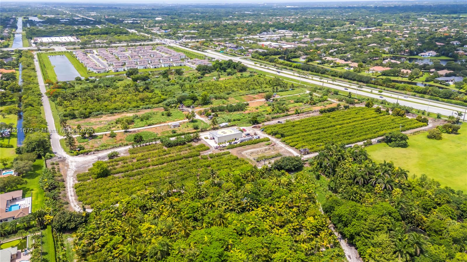 4077 Southwest 121st Terrace Davie, FL 33330 - Photo 47 of 85 an aerial view of residential houses with outdoor space