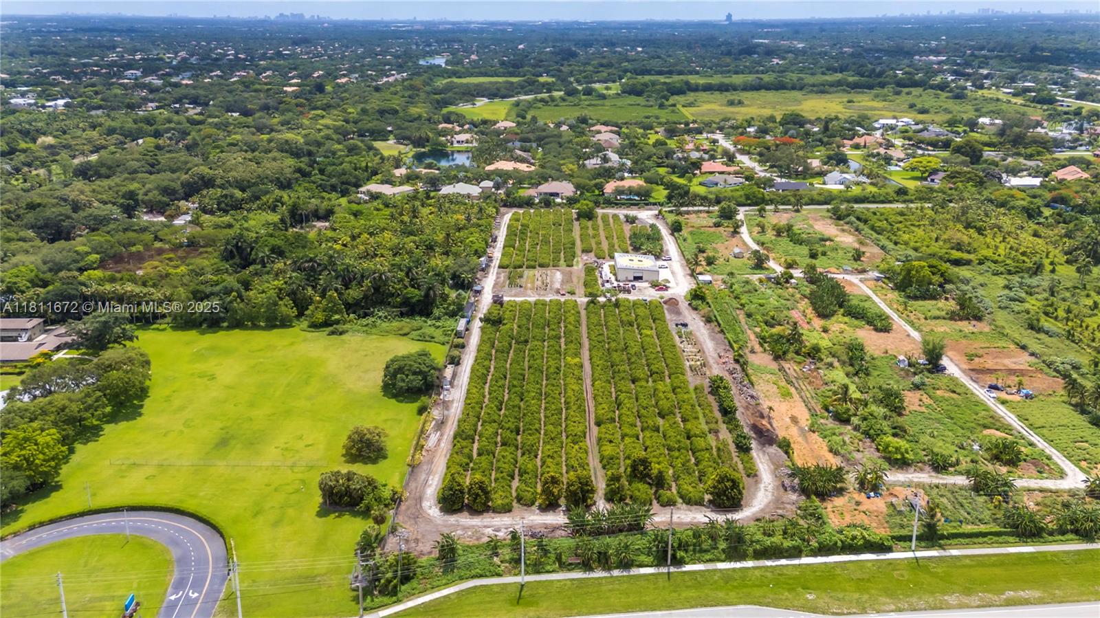 4077 Southwest 121st Terrace Davie, FL 33330 - Photo 57 of 85 an aerial view of residential houses with outdoor space and swimming pool