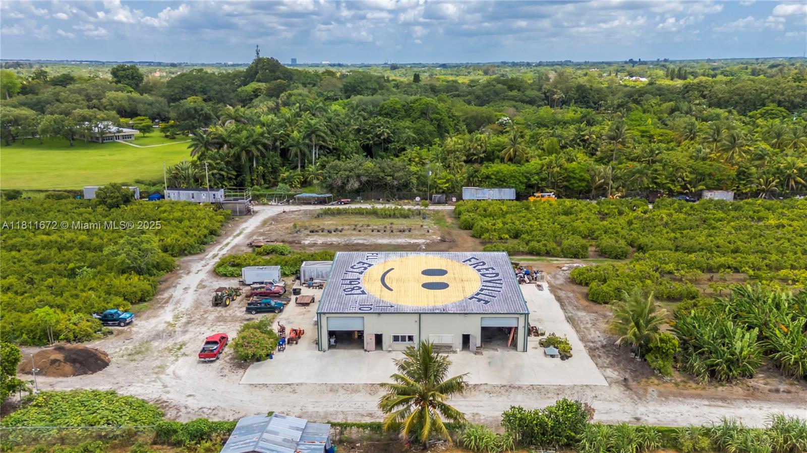 4077 Southwest 121st Terrace Davie, FL 33330 - Photo 77 of 85 an aerial view of a house with a garden and lake view