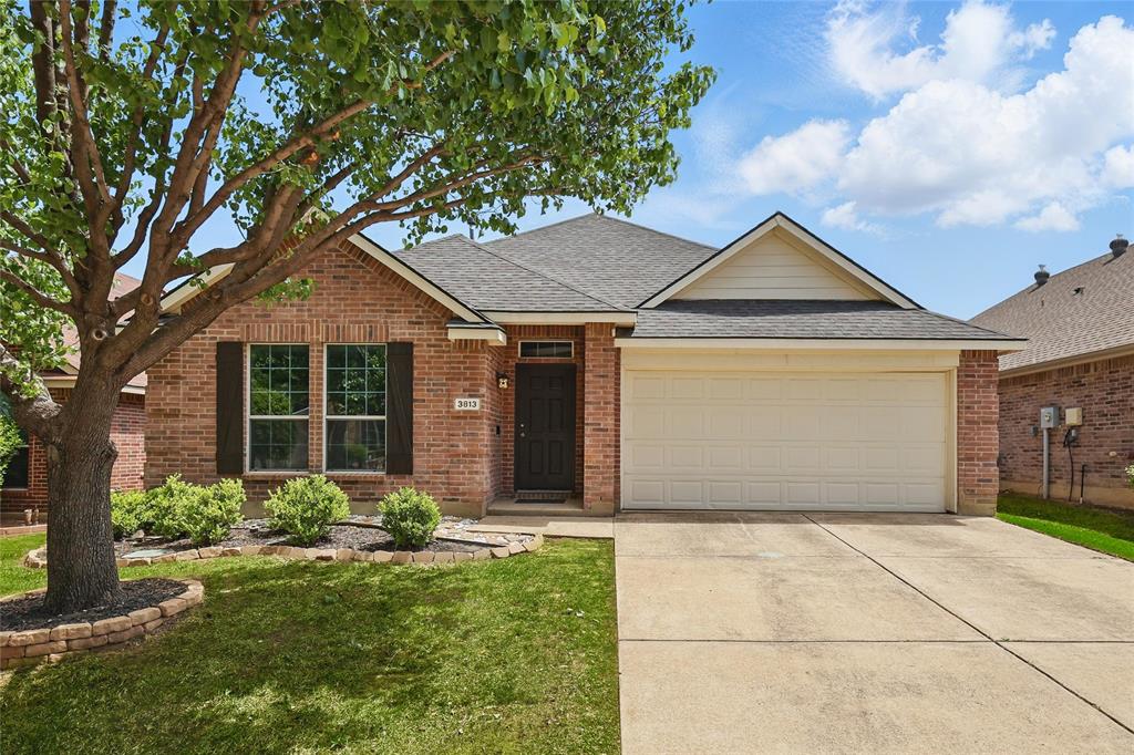 3813 Windy Point Drive Denton, TX 76208 - Photo 1 of 1 a front view of a house with garden
