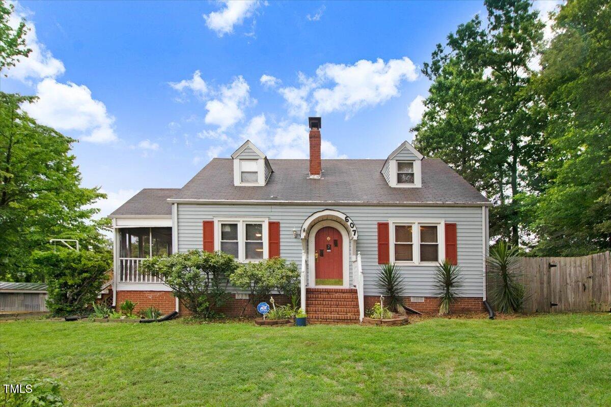 607 East Geer Street Durham, NC 27701 - Photo 1 of 23 a front view of a house with garden and trees