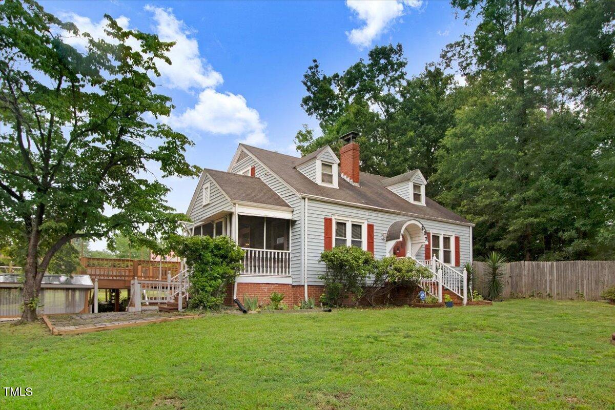 607 East Geer Street Durham, NC 27701 - Photo 2 of 23 a front view of a house with a garden
