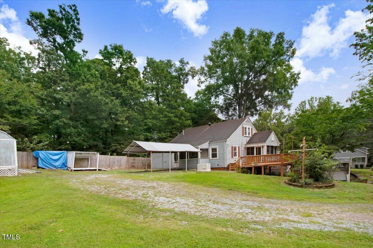 607 East Geer Street Durham, NC 27701 - Photo 3 of 23 a front view of a house with a garden
