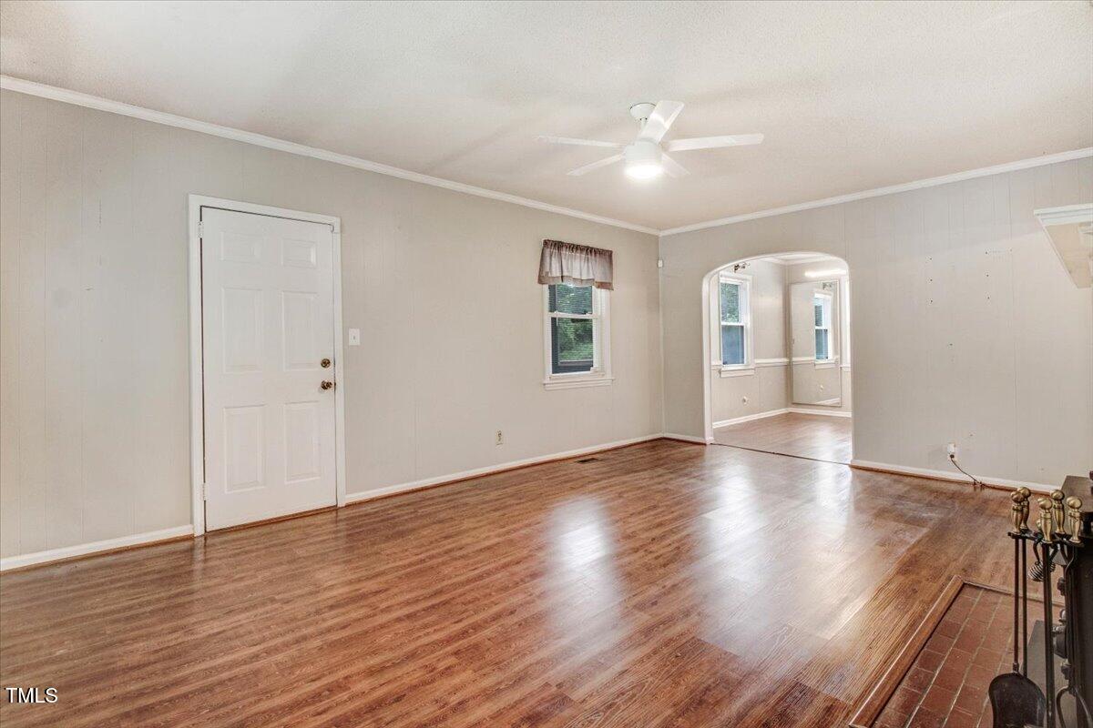 607 East Geer Street Durham, NC 27701 - Photo 6 of 23 an empty room with wooden floor and windows