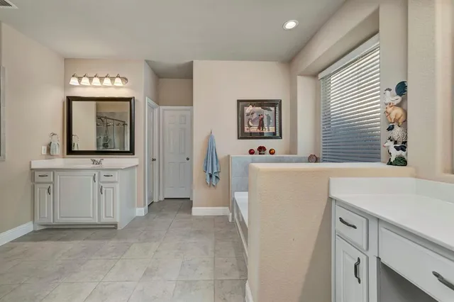 a view of a kitchen cabinets a sink and dishwasher with wooden floor