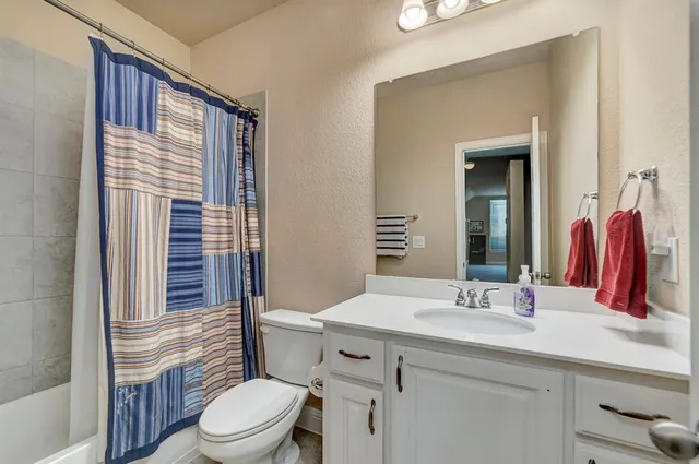 a bedroom with furniture and a window