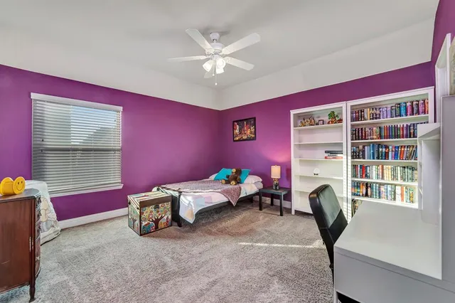 a white toilet sitting next to a bath tub