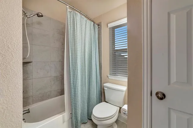 a en suite bathroom with a sink double vanity and a mirror