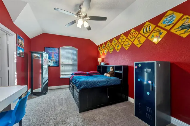 a view of an house with a yard and a fence