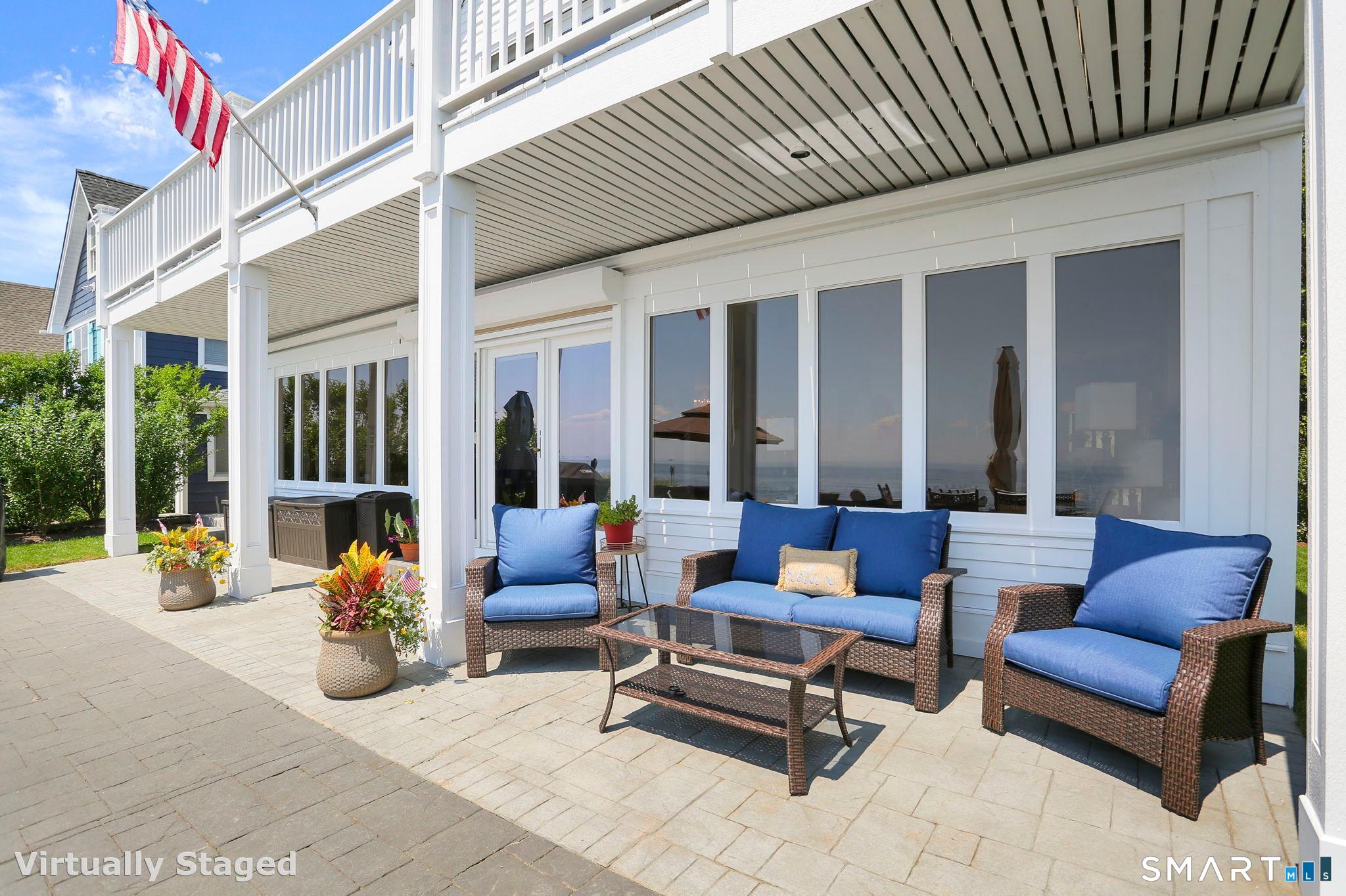 1149 Fairfield Beach Road Fairfield, CT 06824 - Photo 35 of 40 a building outdoor space with patio furniture and potted plants