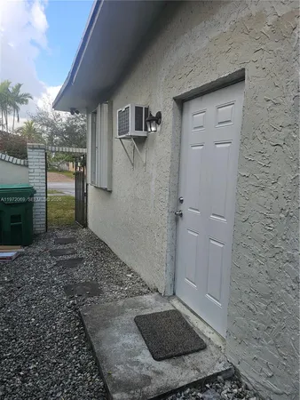a view of a garage with rack and bicycle