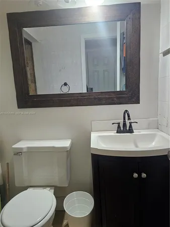 a bathroom with a bathtub and a toilet
