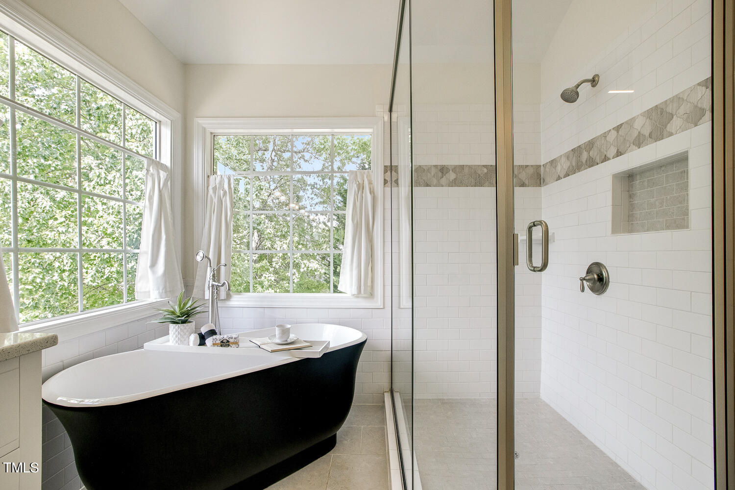 106 Tawny Ridge Lane Cary, NC 27513 - Photo 13 of 19 a view of bathroom with a tub sink and mirror