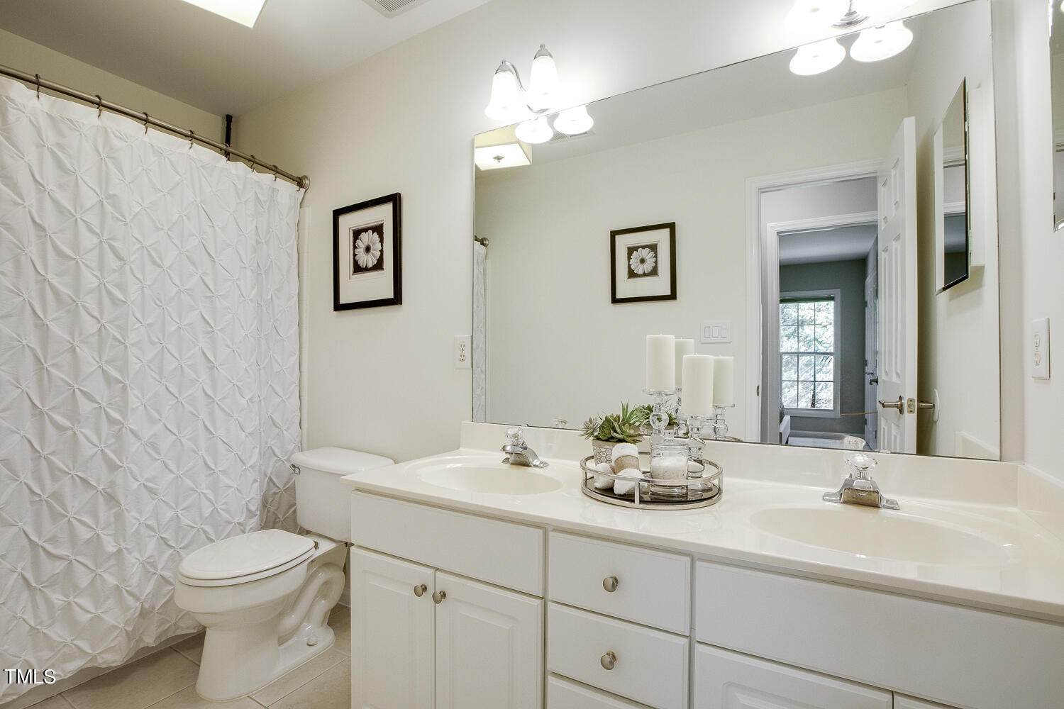 106 Tawny Ridge Lane Cary, NC 27513 - Photo 14 of 19 a bathroom with a sink a toilet and a mirror