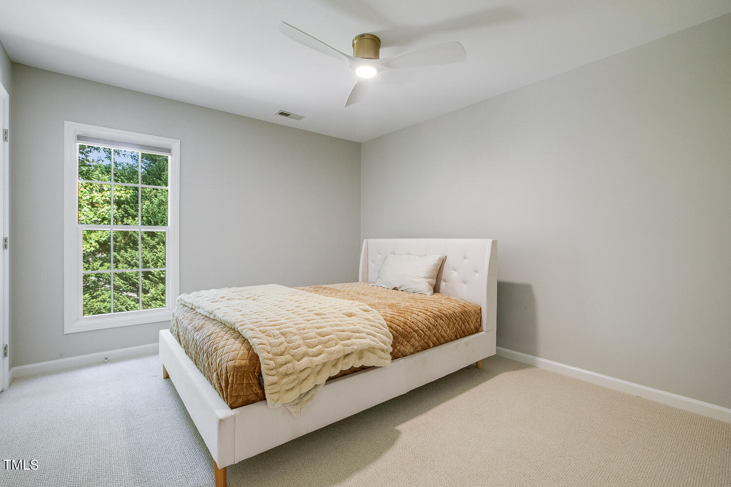 106 Tawny Ridge Lane Cary, NC 27513 - Photo 15 of 19 a bedroom with a bed lamp and window