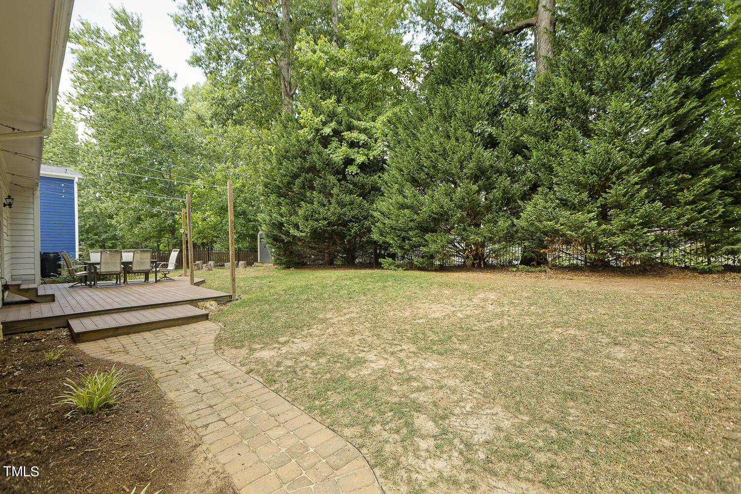 106 Tawny Ridge Lane Cary, NC 27513 - Photo 17 of 19 a view of a yard with potted plants and large trees