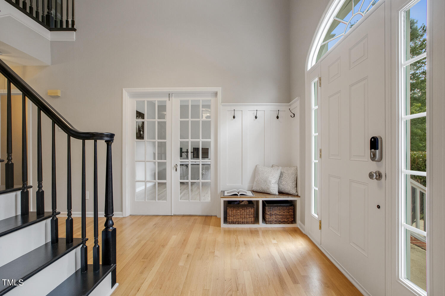 106 Tawny Ridge Lane Cary, NC 27513 - Photo 3 of 19 a view of a hallway with wooden floor and dining room