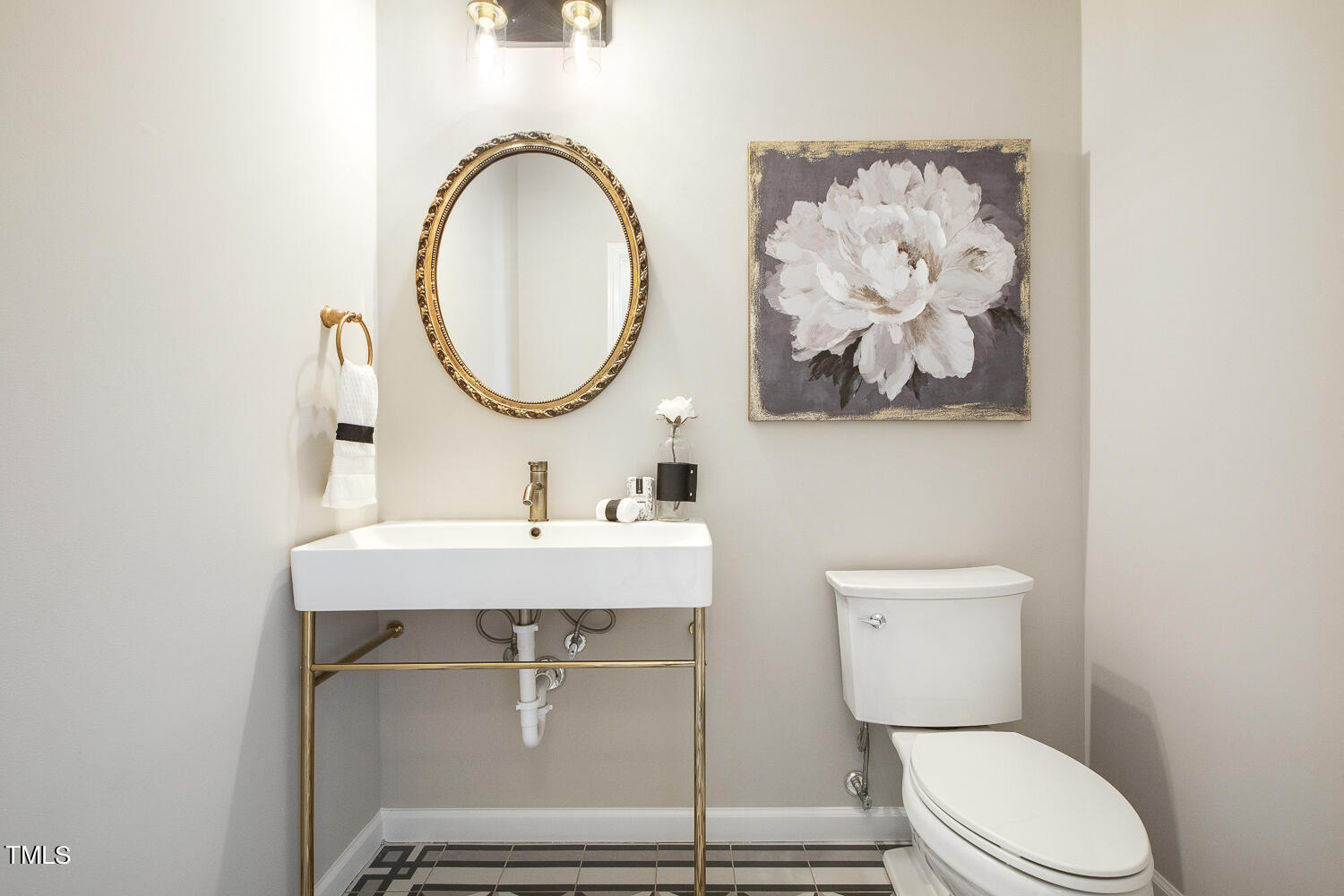 106 Tawny Ridge Lane Cary, NC 27513 - Photo 5 of 19 a bathroom with a toilet a sink and mirror