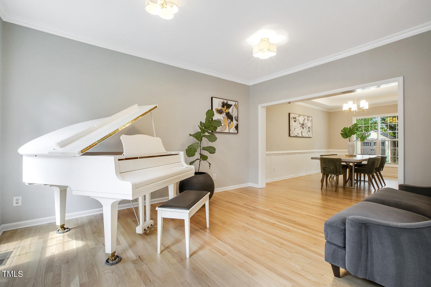 106 Tawny Ridge Lane Cary, NC 27513 - Photo 6 of 19 a view of a dining room with furniture and wooden floor