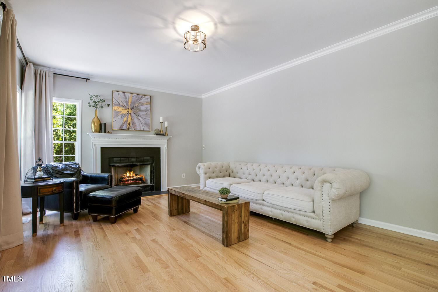 106 Tawny Ridge Lane Cary, NC 27513 - Photo 9 of 19 a living room with furniture and a fireplace