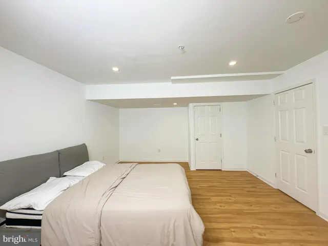 a bedroom with a bed and a walk in closet