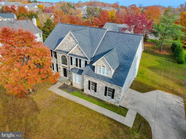 an aerial view of house with yard